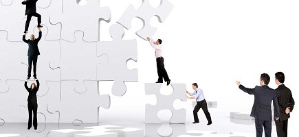 business team work building a puzzle isolated over a white background